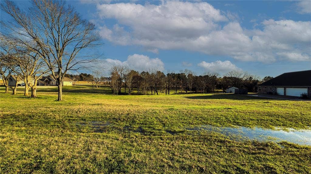 5455 Saddle Ridge Court, Athens, TX 75752 View of yard featuring a garage