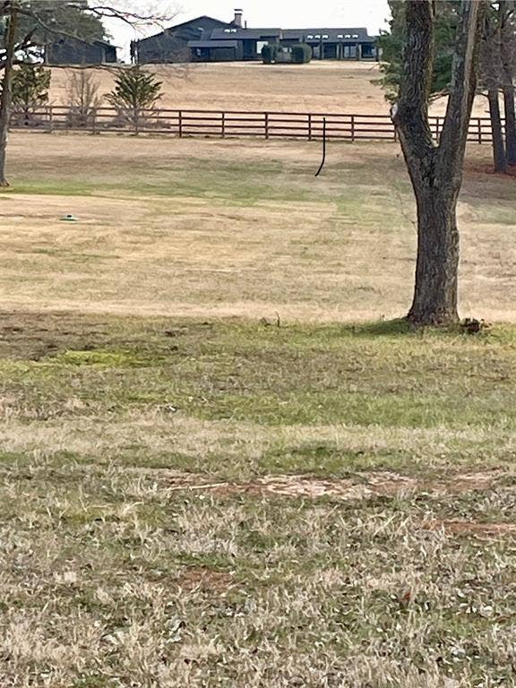 5455 Saddle Ridge Court, Athens, TX 75752 View of community with a rural view, a lawn, and fence