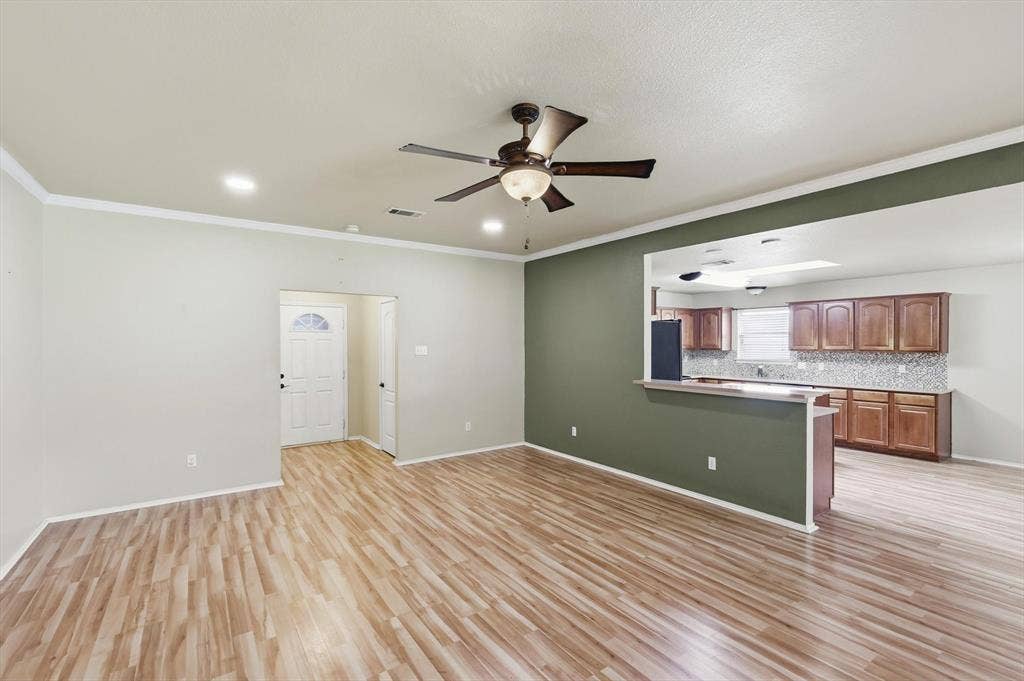 6421 Peak View Court, Midlothian, TX 76065 A living room view open to the kitchen
