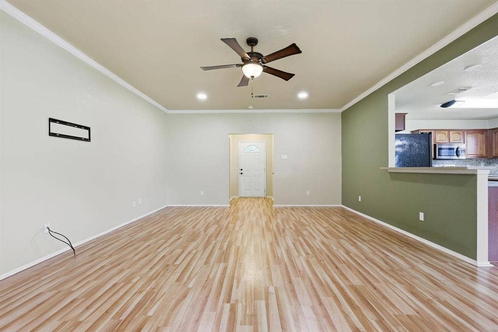6421 Peak View Court, Midlothian, TX 76065 A view of the living room toward the front entry