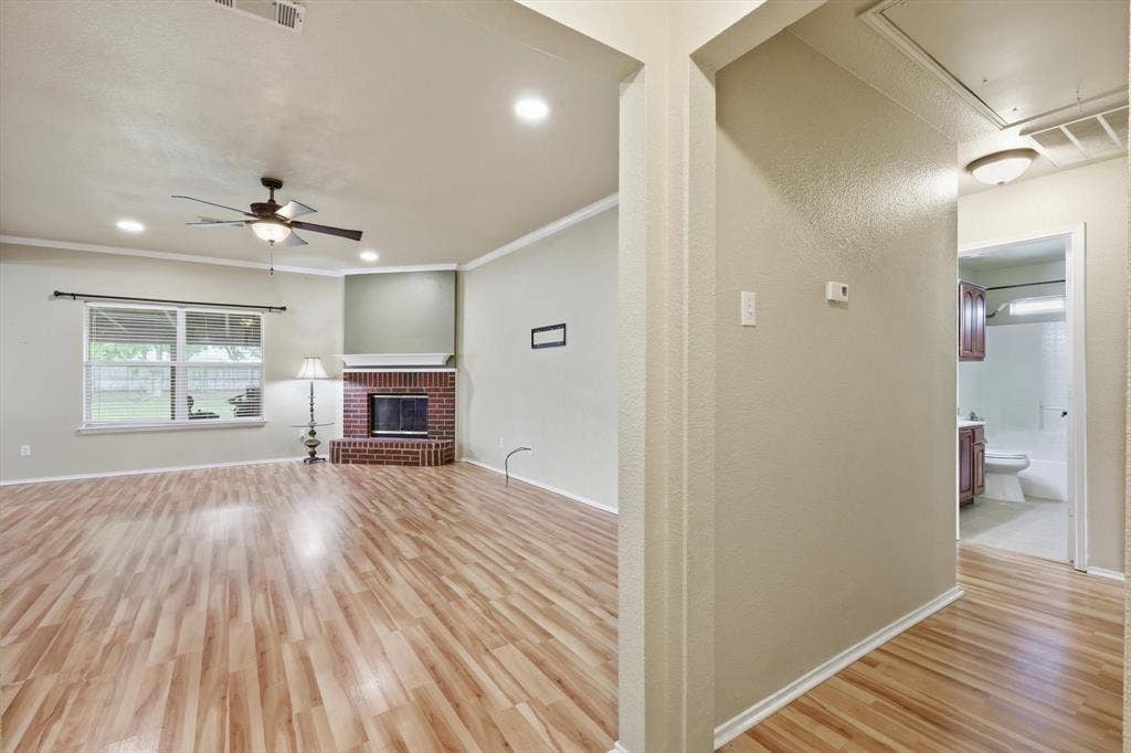 6421 Peak View Court, Midlothian, TX 76065 A view from the front entry toward the living area and hallway.