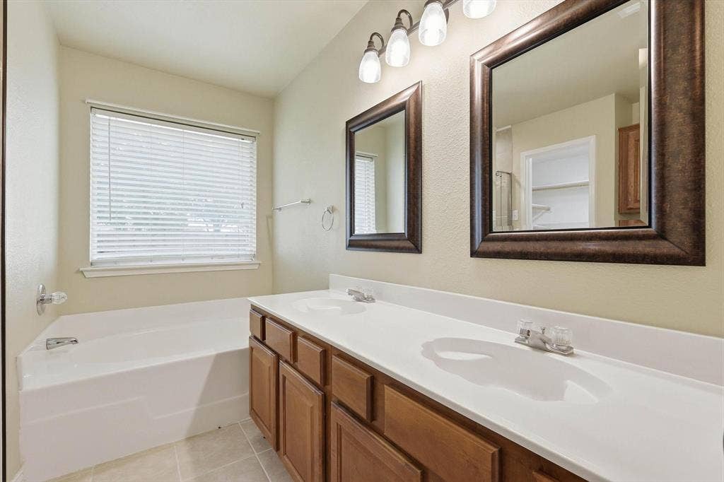 6421 Peak View Court, Midlothian, TX 76065 The vanity in the primary bath has two sinks and lots of counter space.