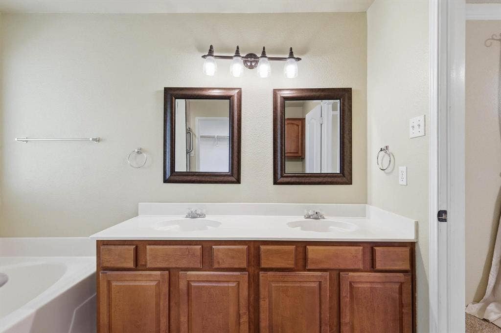 6421 Peak View Court, Midlothian, TX 76065 The primary bathroom has two sinks and plenty of space