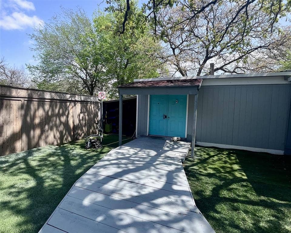 3020 Delaware Trail, Lake Worth, TX 76135 View of outdoor structure with an outdoor structure, a carport, and fence