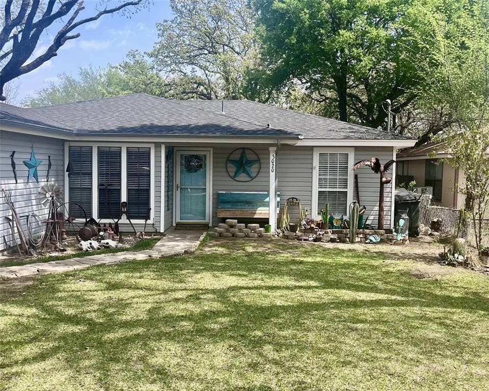 3020 Delaware Trail, Lake Worth, TX 76135 Single story home with a front yard, fence, and roof with shingles