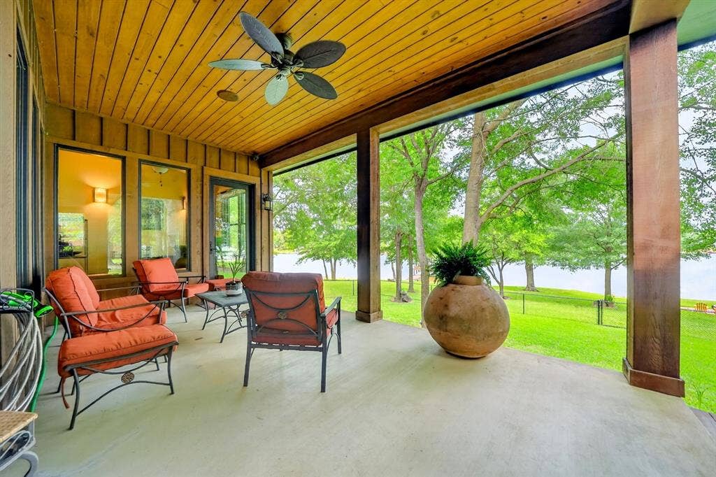 15491 Presidio Circle, Caney City, TX 75148 Covered patio with a natural wood plank ceiling, an outdoor ceiling fan, and a concrete slab floor