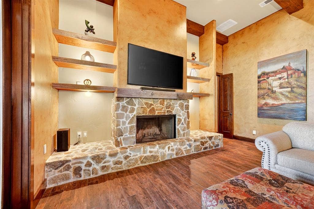 15491 Presidio Circle, Caney City, TX 75148 Stone-clad fireplace with a substantial hearth and wood mantel