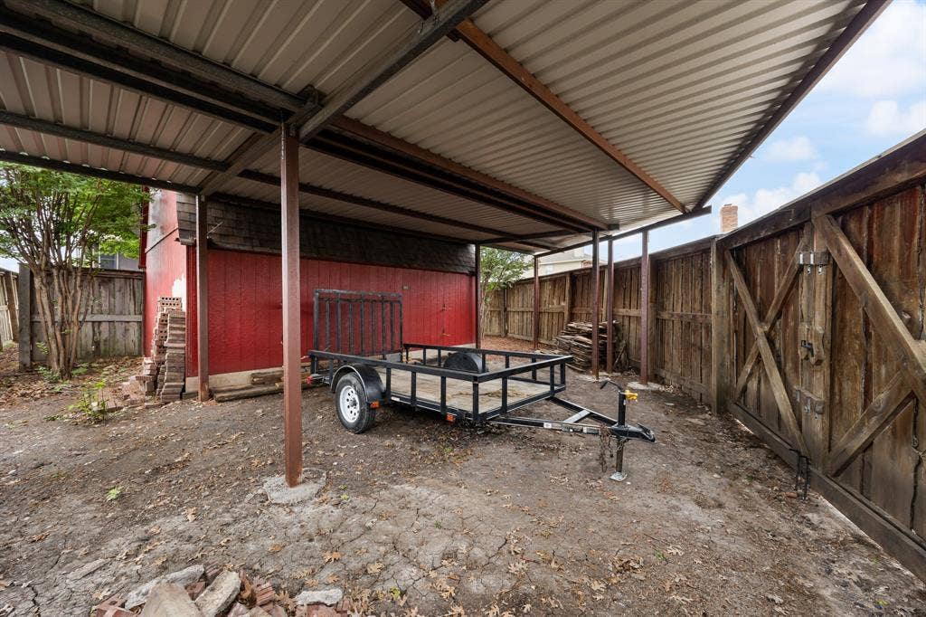 9209 Chimneywood Drive, Rowlett, TX 75089 Gated carport allows for additional parking for a boar, RV, worktruck, etc.