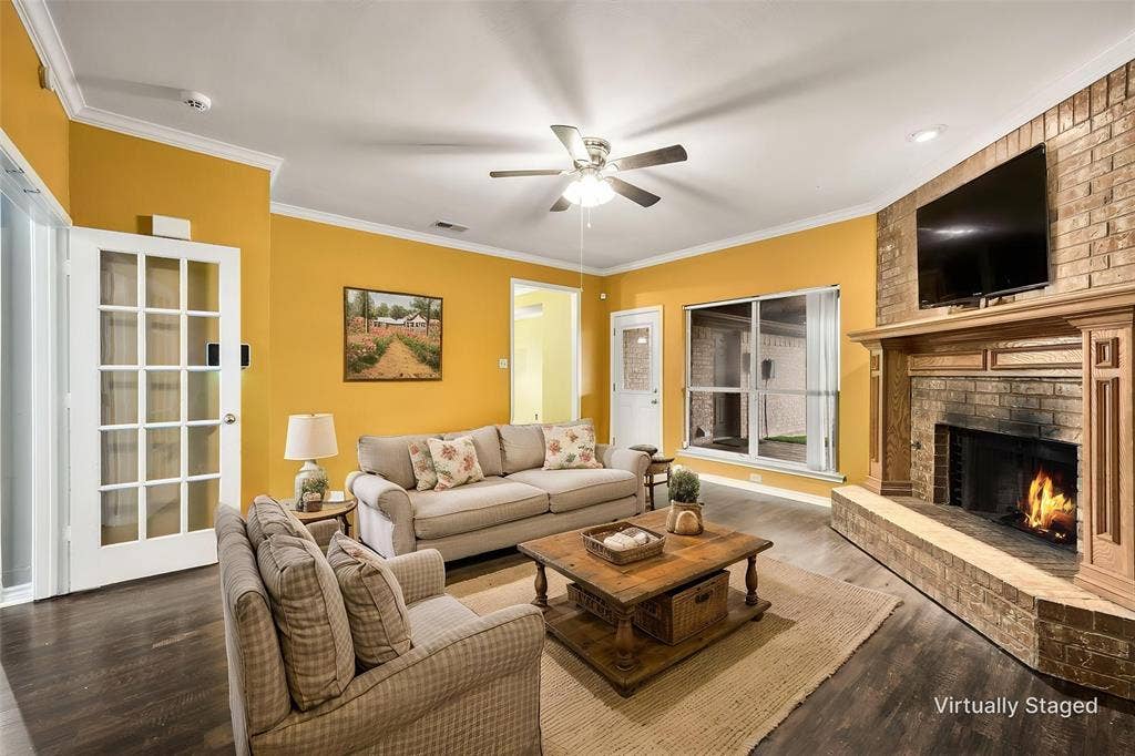 9209 Chimneywood Drive, Rowlett, TX 75089 Cozy family room with brick fireplace that has a gas starter for gas logs.