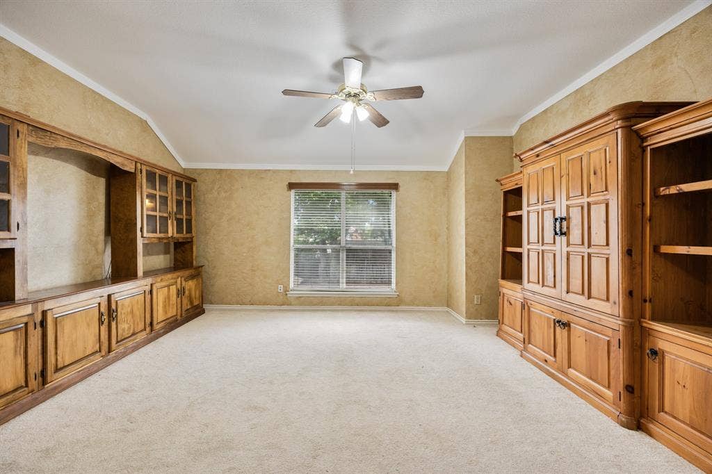 9209 Chimneywood Drive, Rowlett, TX 75089 2nd floor living area with TV cabinet and storage or display cabinets.