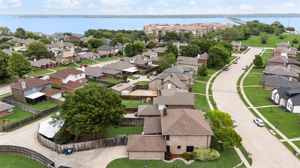 9209 Chimneywood Drive, Rowlett, TX 75089 Extra long driveway - large corner lot. Big back yard plus extra covered parking thru gated alley entrance.