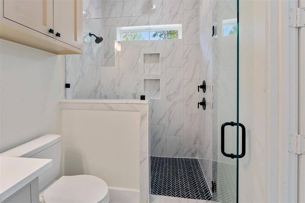 802.5 N Needmore Street, Athens, TX 75751 Full bathroom with vanity and a marble finish shower