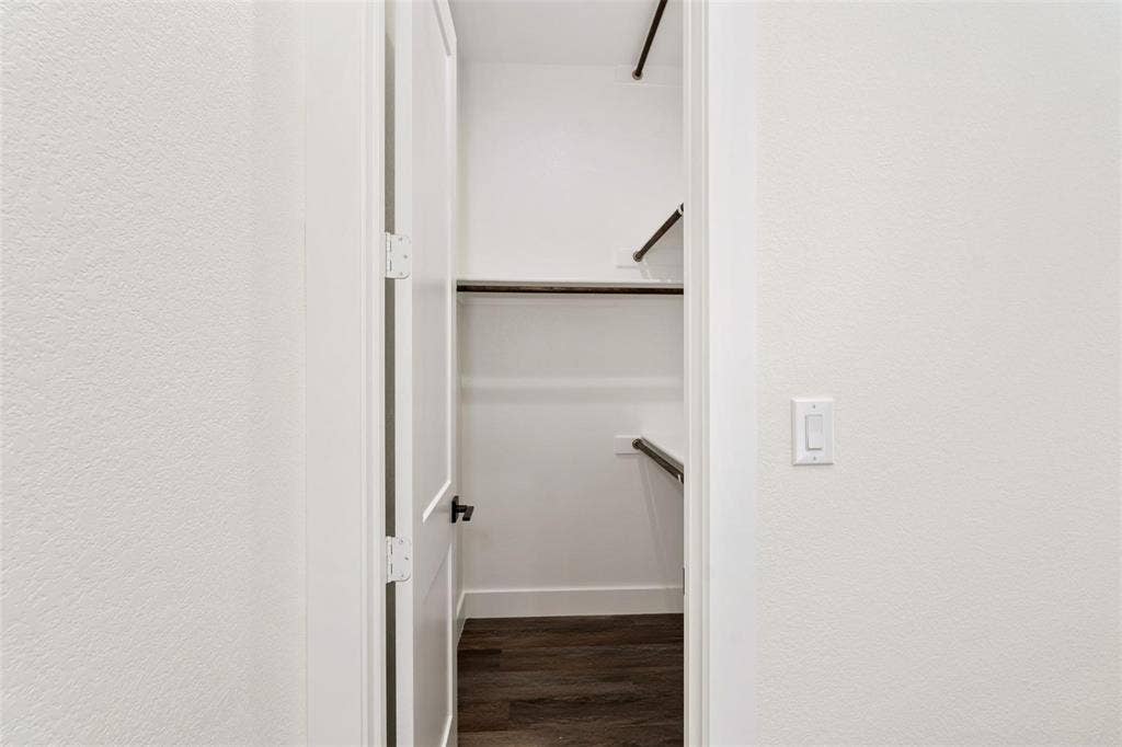802.5 N Needmore Street, Athens, TX 75751 Walk in closet featuring dark wood-type flooring