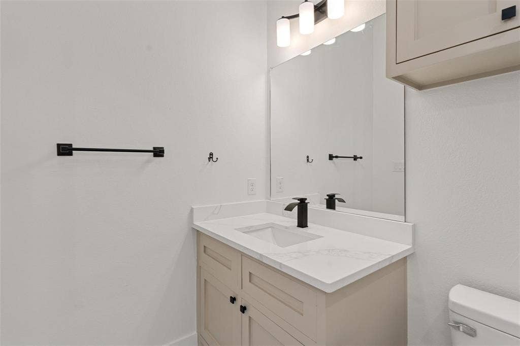 802.5 N Needmore Street, Athens, TX 75751 Bathroom featuring toilet and vanity