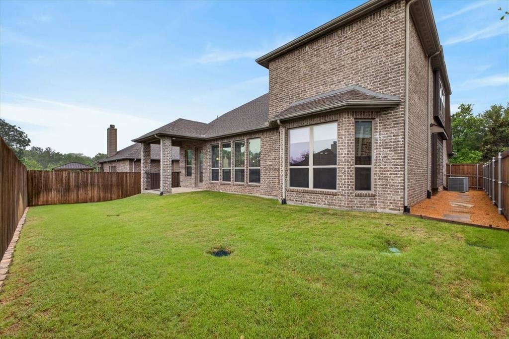 2417 Barclay Court, Plano, TX 75074 This yard is needing your perosnal attention. Beautiful pebble and stone path on both sides of the house.
