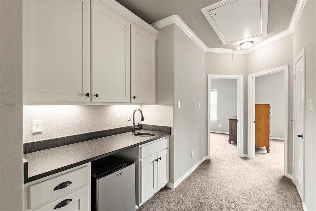 164 Marina Drive, Mabank, TX 75156 Upstair wet bar services bonus room and 3 guest bedrooms. Perfect as coffee and beverage bar without having to go downstairs.