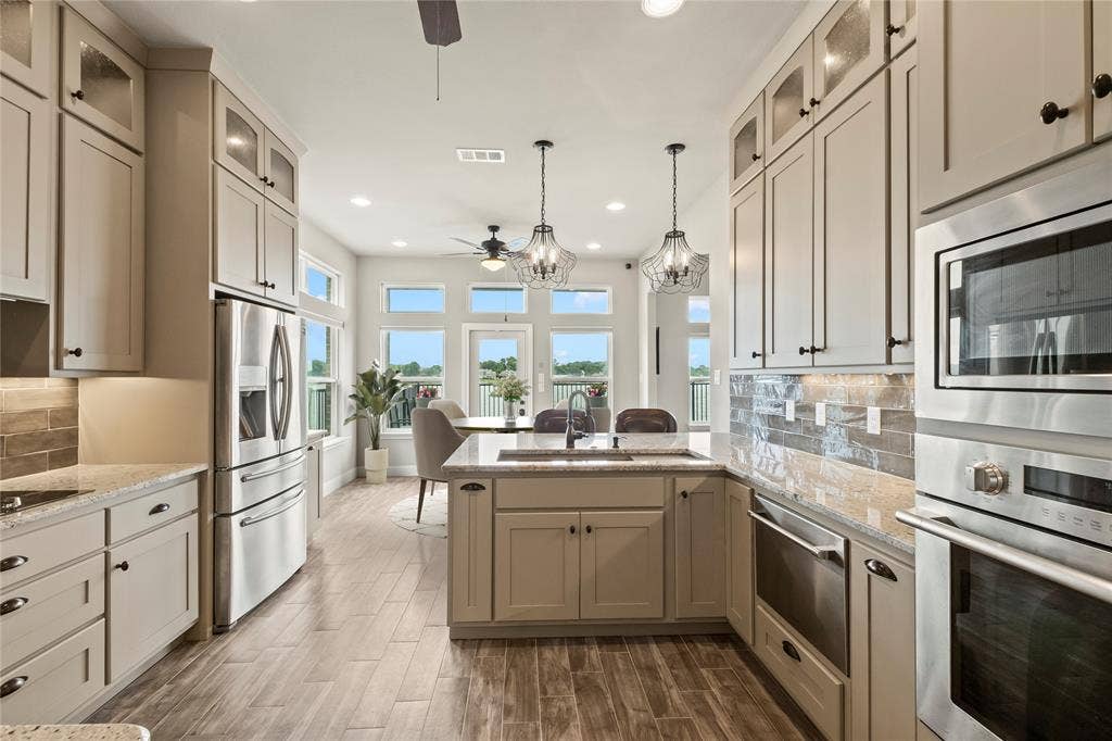 164 Marina Drive, Mabank, TX 75156 Staged Photo* Stainless steel built in oven, microwave and drawer dishwasher.