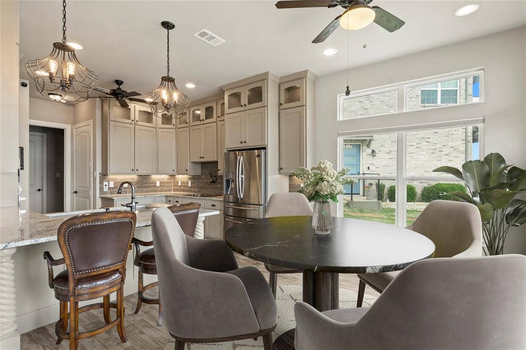 164 Marina Drive, Mabank, TX 75156 Staged Photo* Dining area and kitchen bar seating.