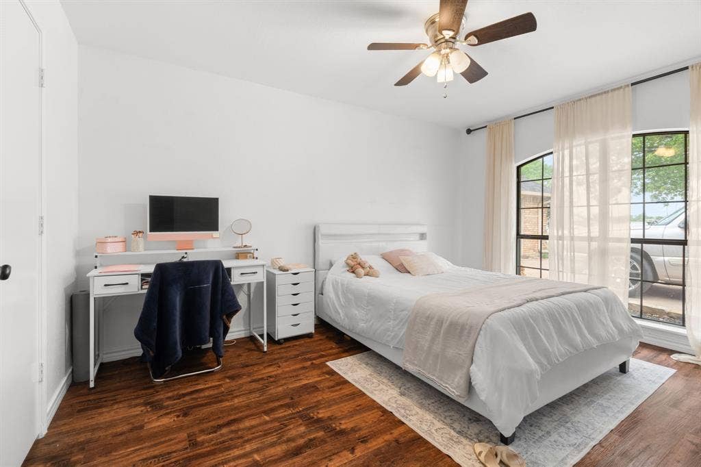 4200 Jennifer Lane, Crowley, TX 76036 Bedroom with dark wood-style flooring, a desk, and ceiling fan