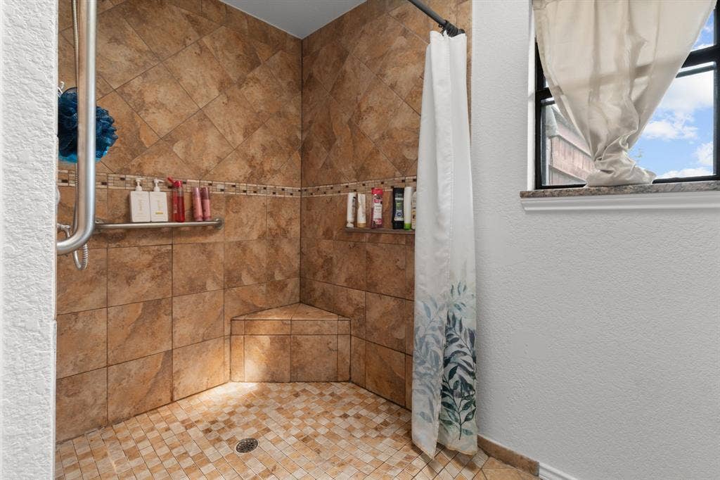 4200 Jennifer Lane, Crowley, TX 76036 Full bath featuring a stall shower and a textured wall
