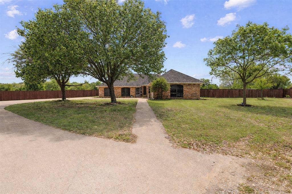 4200 Jennifer Lane, Crowley, TX 76036 Single story home featuring brick siding