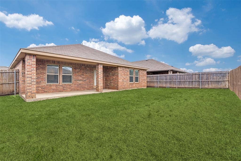 877 Darst Drive, Fate, TX 75189 Covered patio and fenced in backyard