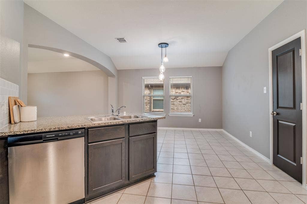 877 Darst Drive, Fate, TX 75189 Kitchen open to dining and living room