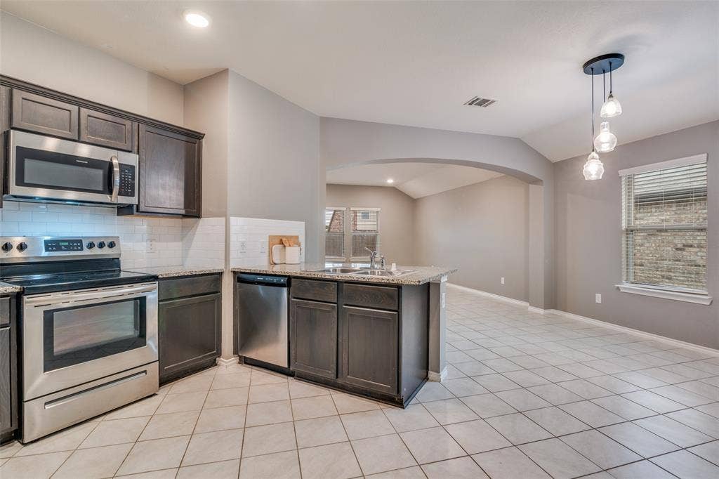877 Darst Drive, Fate, TX 75189 Kitchen open to living room