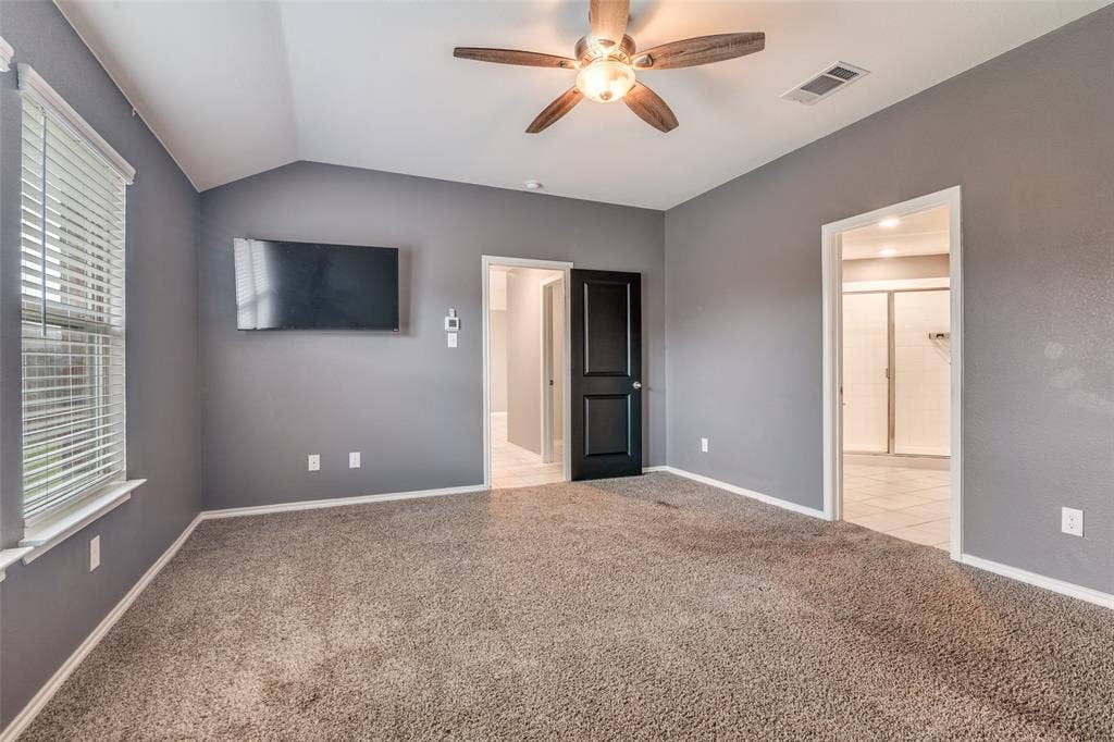 877 Darst Drive, Fate, TX 75189 Primary bedroom with ensuite bathroom and two walk in closets