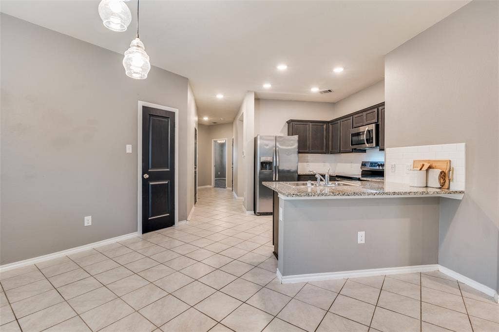 877 Darst Drive, Fate, TX 75189 Kitchen open to living room