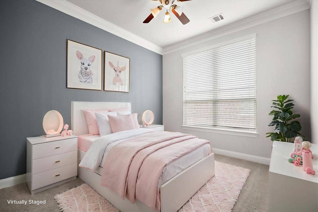 Bedroom featuring a ceiling fan, crown molding, and a large window with blinds