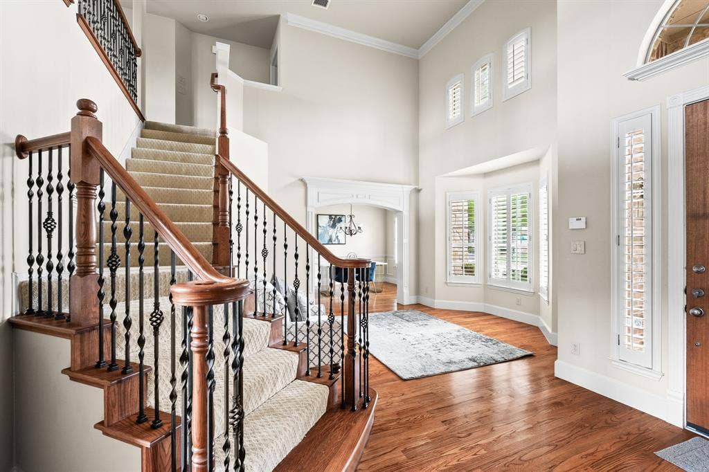 Entryway looking at formal living and dining rooms with plantation shutters