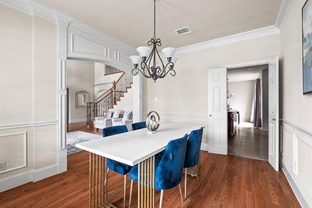 Dining room looking into kitchen on the right and formal living on the left.