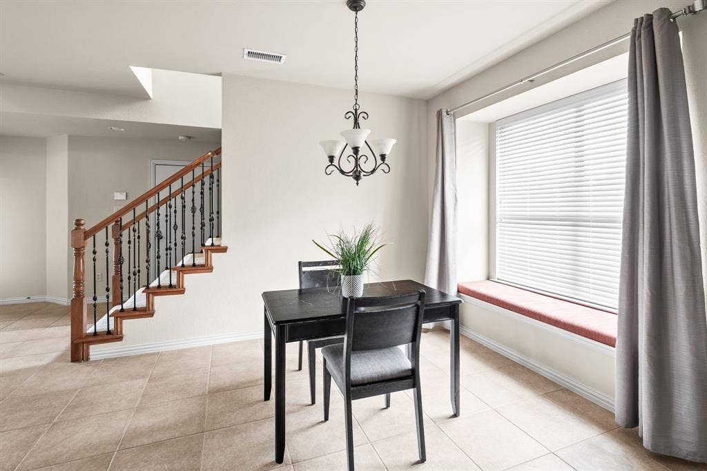 Casual diining in ktichen area with beautiful bench seat and natural light.