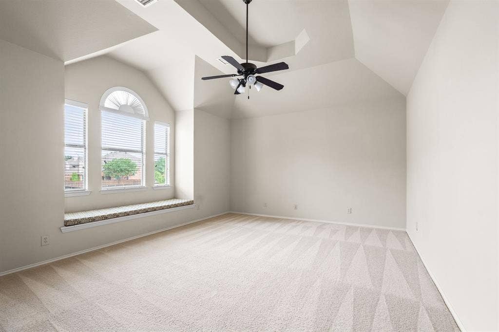 Large game room with bench seating for storage, tons of natural light and tray ceiling. (Note:Game room is over the garage so no concerns with potential noise)