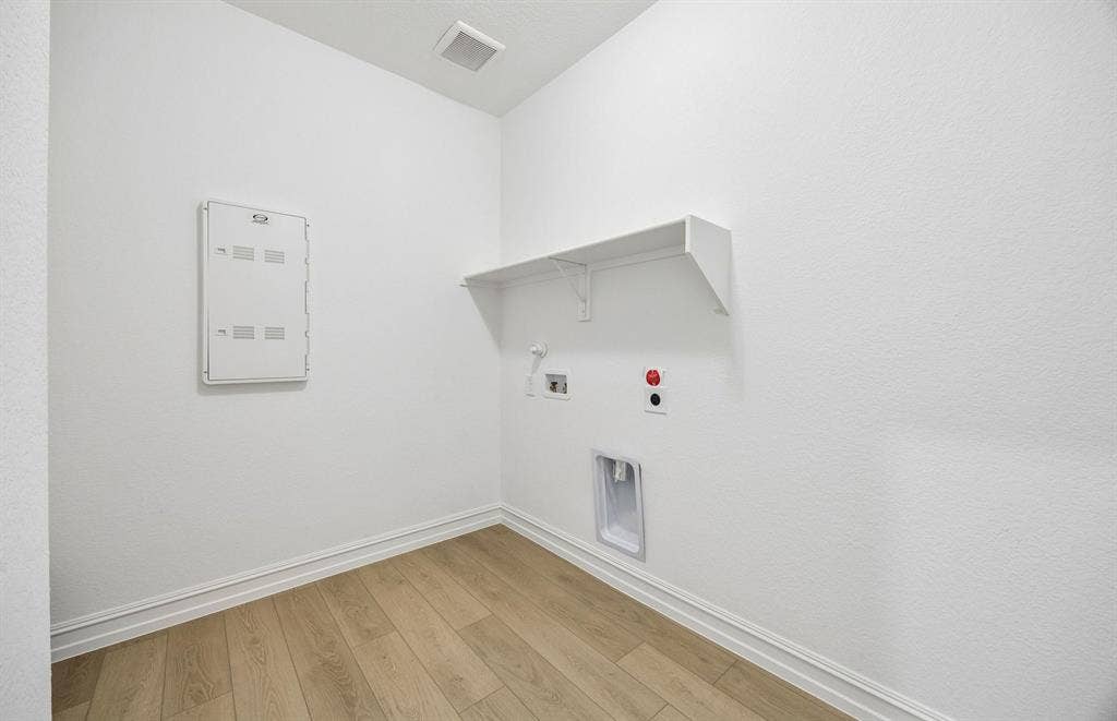 7337 Kurth Lane, McKinney, TX 75071 Laundry room with built-in shelving