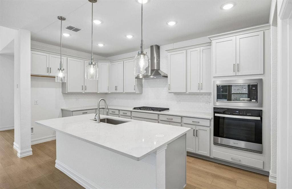 7337 Kurth Lane, McKinney, TX 75071 Beautiful pendent lighting in kitchen