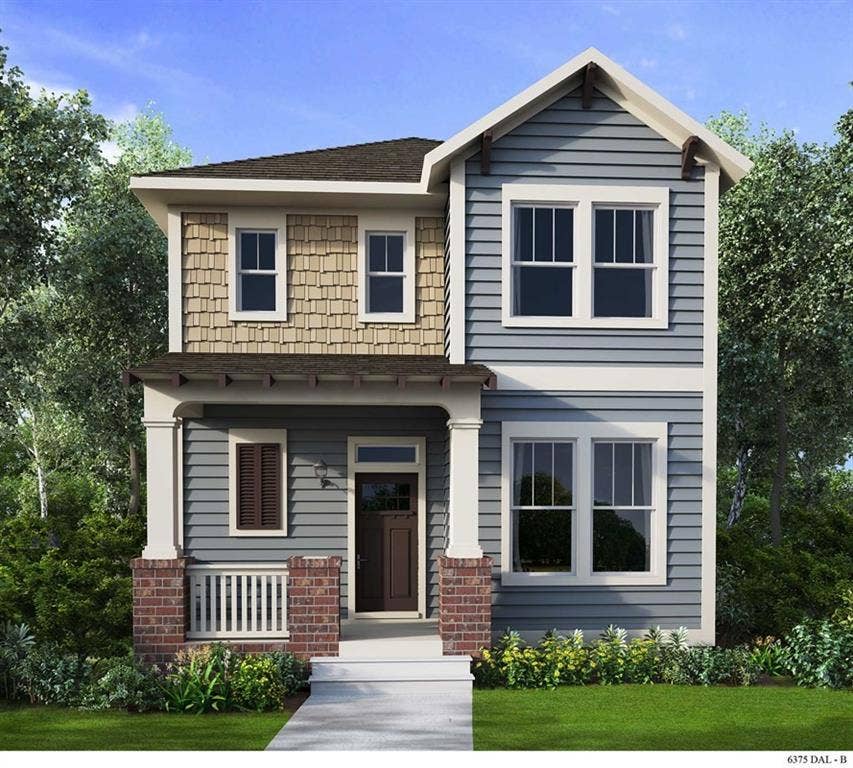 The property features a charming exterior with blue siding and tan shake accents