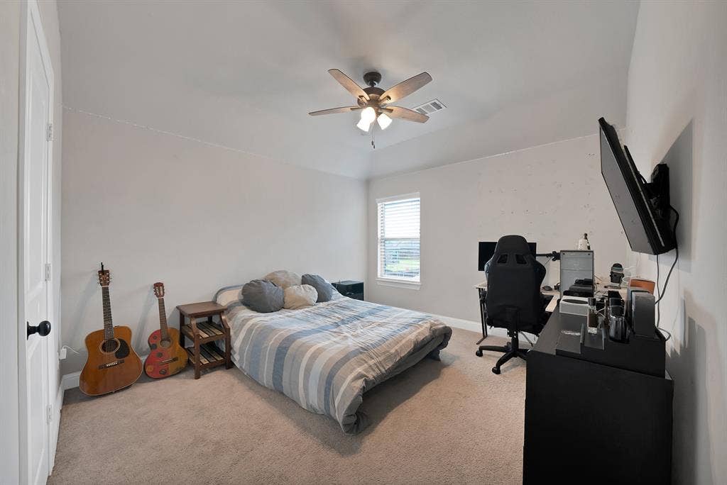 1905 Silver Falls Drive, Burleson, TX 76028 This room features carpeted flooring, a ceiling fan, and a window with blinds