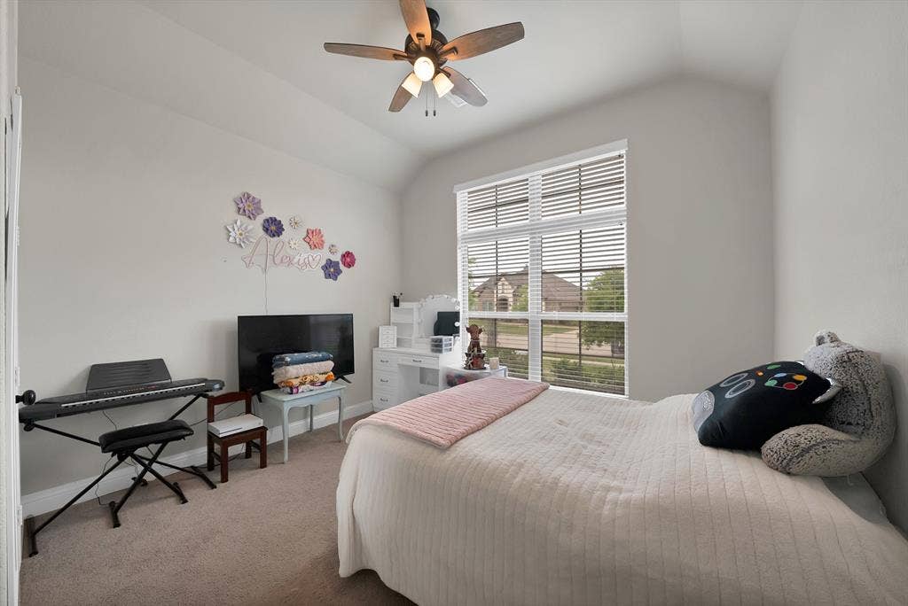 1905 Silver Falls Drive, Burleson, TX 76028 This room features an angled ceiling and a window with blinds, allowing for natural light