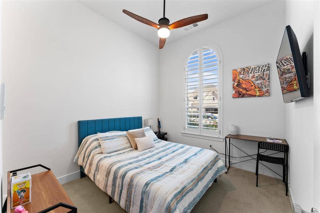 216 Shetland Lane, Northlake, TX 76247 This room features a high vaulted ceiling, an arched window with plantation shutters, and a ceiling fan