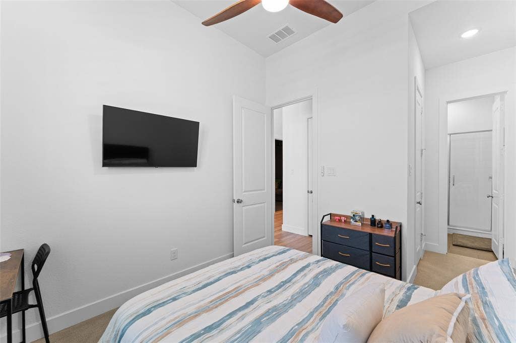 216 Shetland Lane, Northlake, TX 76247 The room features light-colored walls and flooring, with a ceiling fan providing air circulation