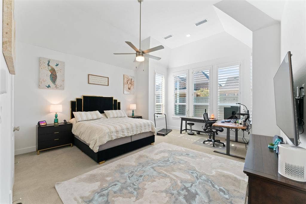 216 Shetland Lane, Northlake, TX 76247 This room features a high vaulted ceiling, light-colored carpeting, and a ceiling fan with a light fixture