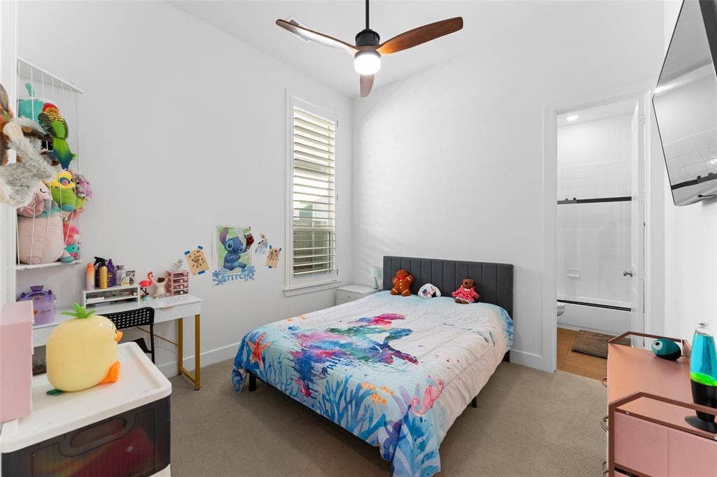 216 Shetland Lane, Northlake, TX 76247 Bedroom featuring carpeted flooring, a ceiling fan with integrated lighting, and a window with white louvered blinds