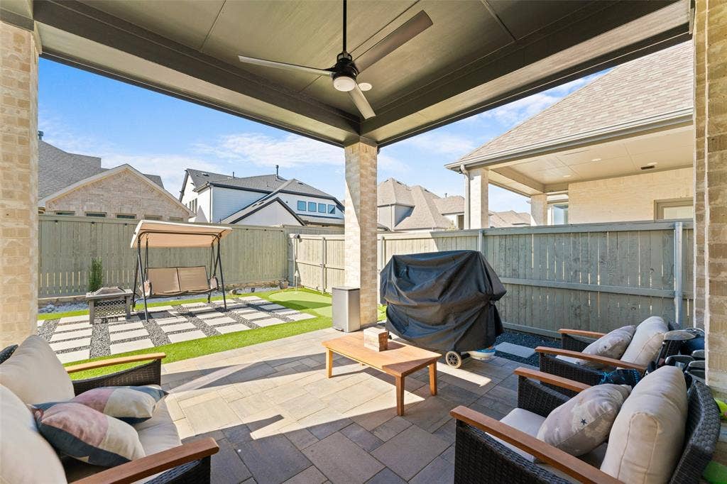 216 Shetland Lane, Northlake, TX 76247 The covered patio features a ceiling fan, providing a comfortable outdoor living space
