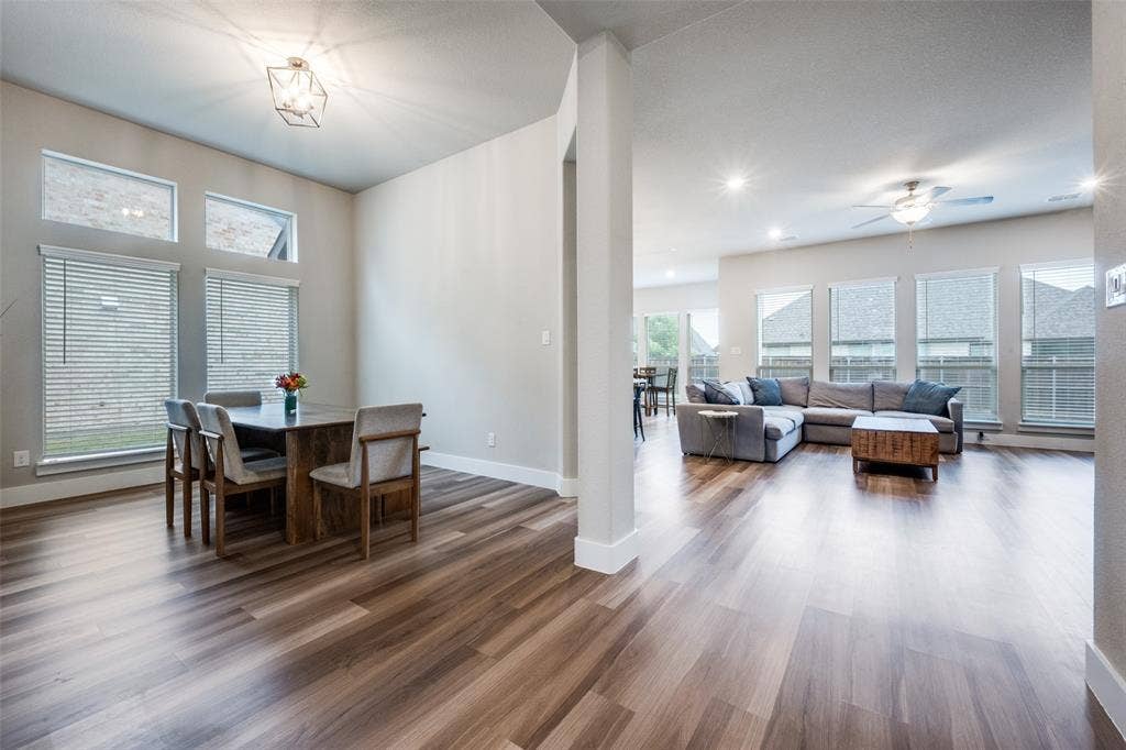 2801 Bedford Road, Northlake, TX 76226 The open-concept living space features a huge living room just off the formal dining and kitchen, with ample natural lighting from the large windows.