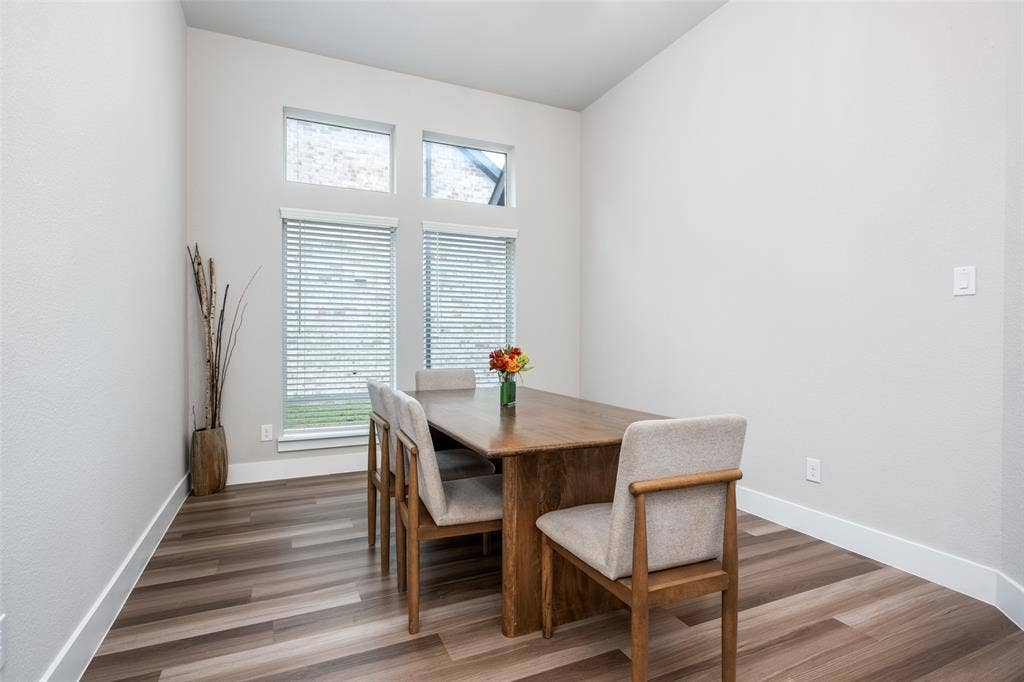 2801 Bedford Road, Northlake, TX 76226 The formal dining is bright and spacious. This table for 8 could easily be replaced with a 12-person table.