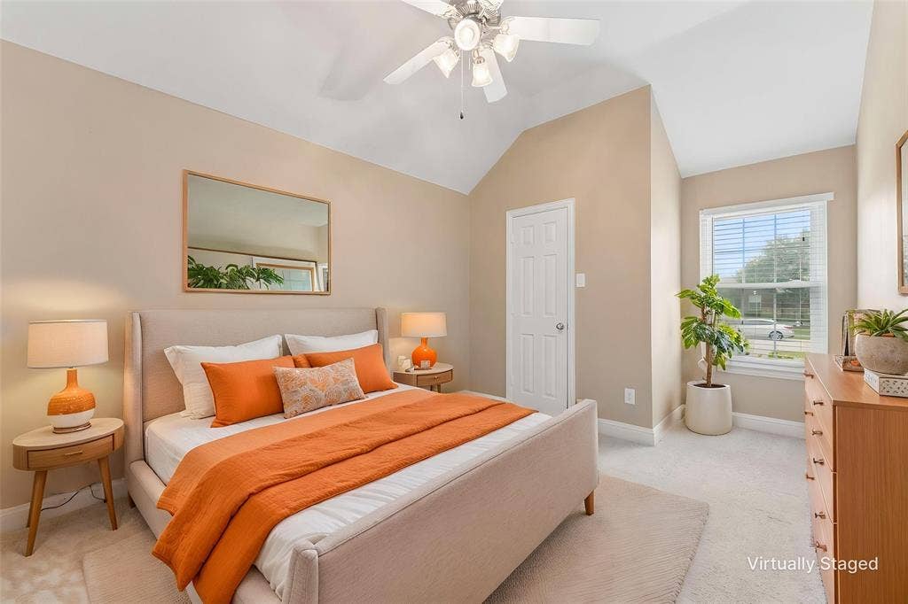 1221 Amistad Drive, Prosper, TX 75078 The bedroom features vaulted ceilings, a window with blinds, and light-colored carpeting