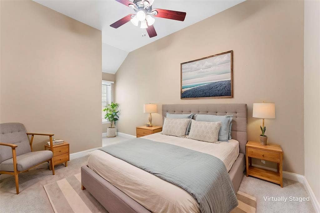 1221 Amistad Drive, Prosper, TX 75078 This room features vaulted ceilings, light neutral wall colors, and carpeted flooring