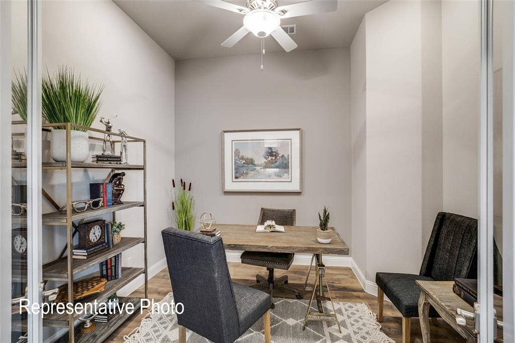 1415 Odette Drive, Arlington, TX 76013 This versatile room features light-toned walls, a ceiling fan, and wood-look flooring